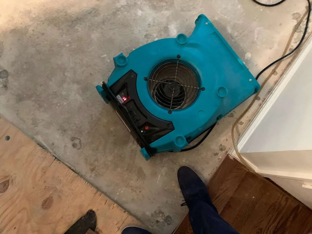 Air mover drying subfloor during Leak Detection & Repair in Kapolei